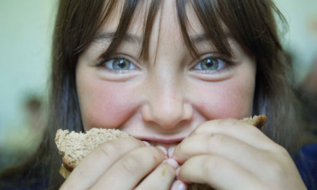 Girl eats sandwich