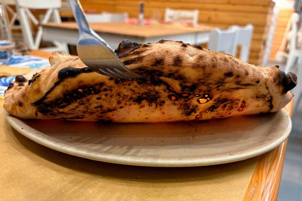 la cottura della pizza Margherita della pizzeria Doro Gourmet a Macerata Campania per il Campionato 2025